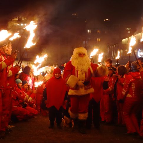 Father Christmas arriving in Les Gets with torches