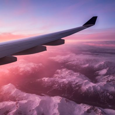 A plane above mountains